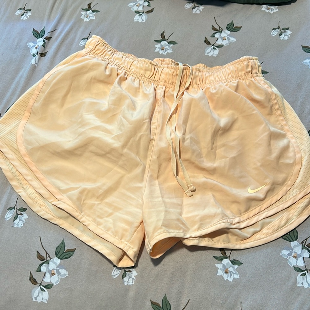 Women’s orange Nike shorts
